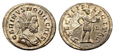 Antoniniano (aureliano) de Carino. SAECVLI FELICITAS. Carino estante a dcha. Lugdunum. 2344343.m